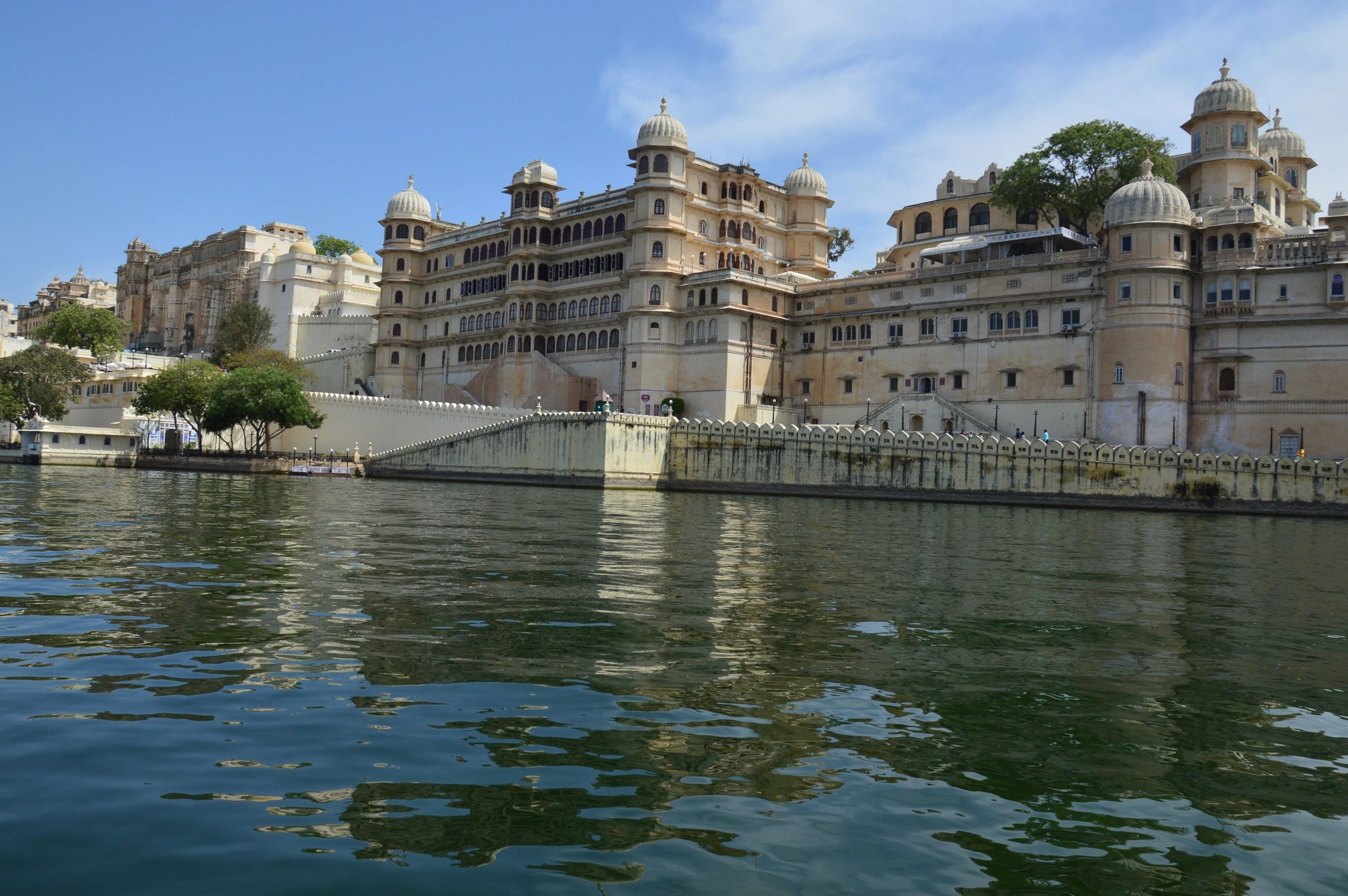 Waterfront view of the City Palace complex on Lake Pichola, Udaipur district, Udaipur, Rajasthan, India.